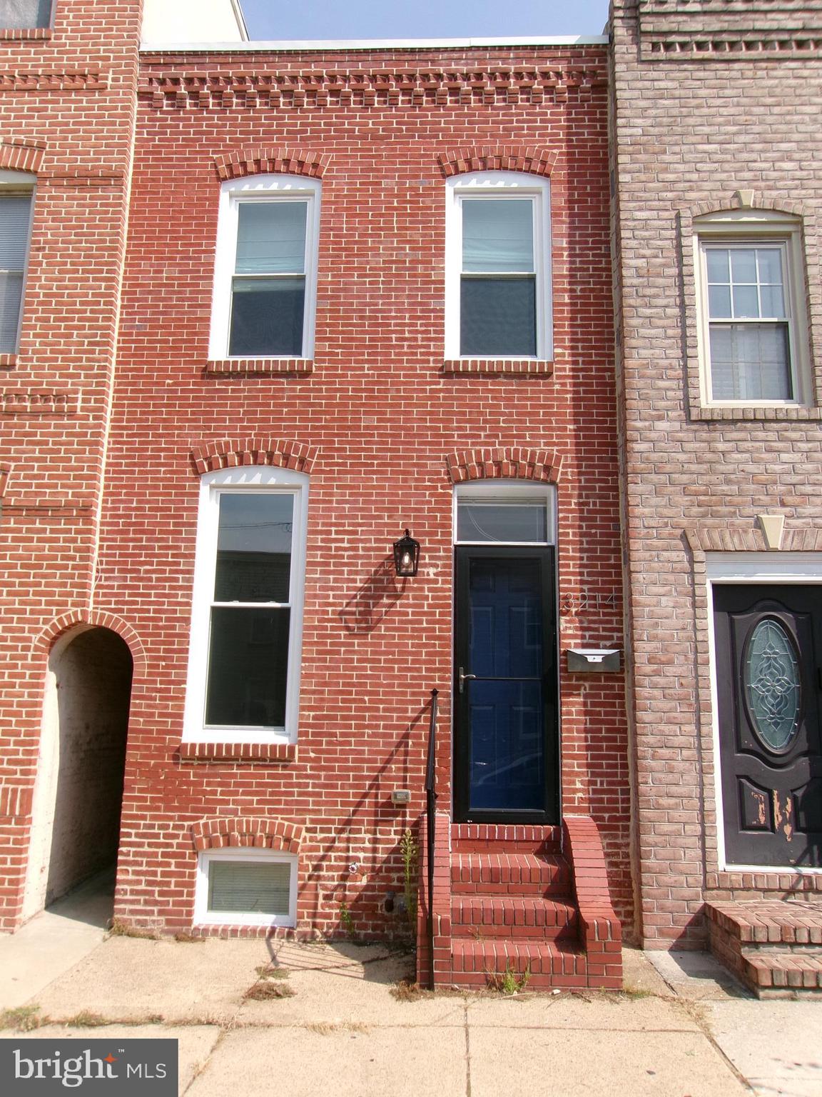 a front view of a house with stairs