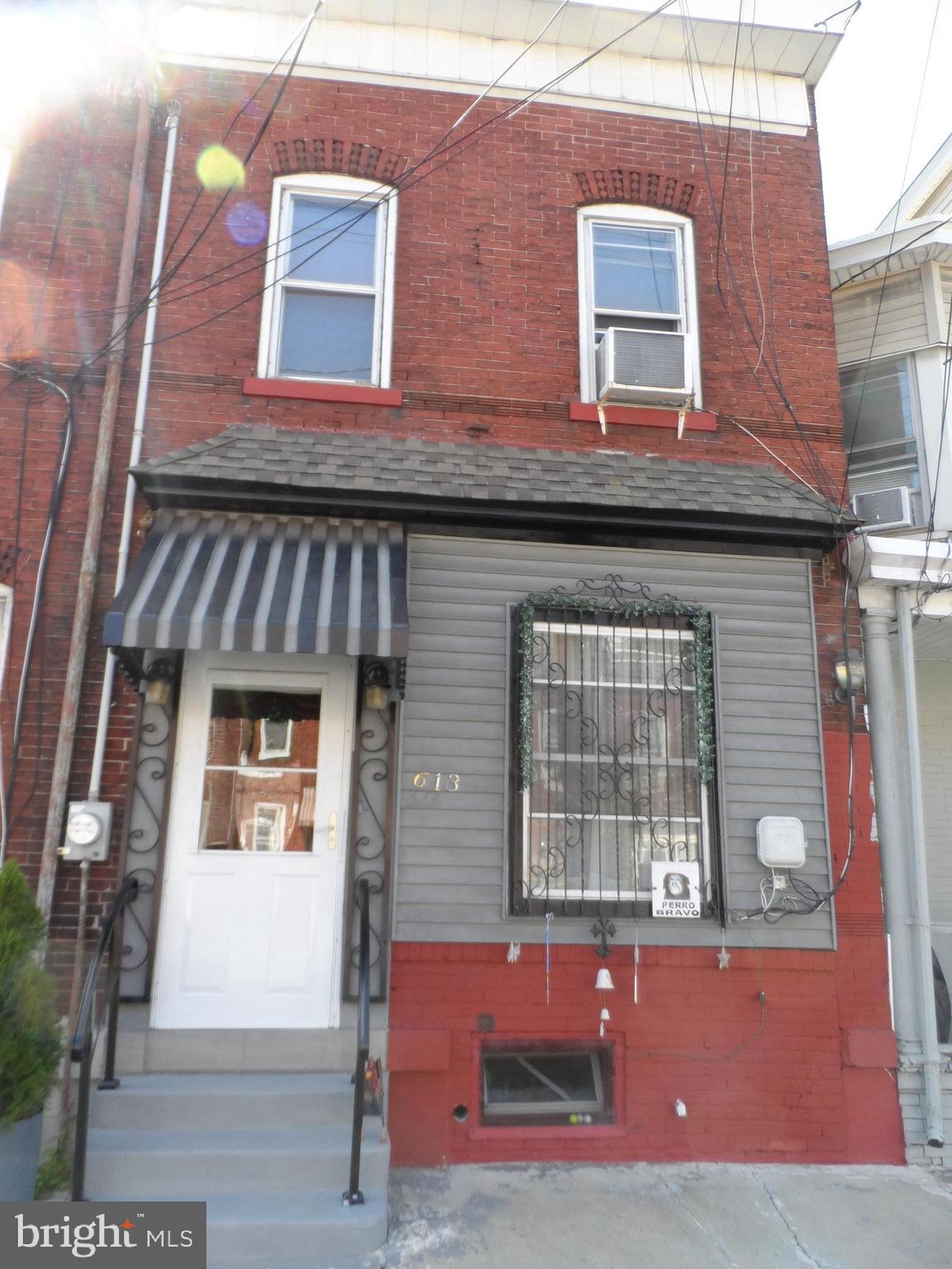 a front view of a house with parking