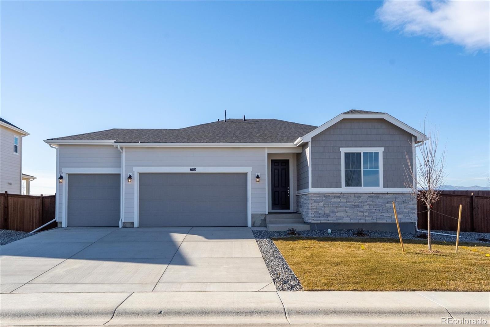 a front view of a house with garage