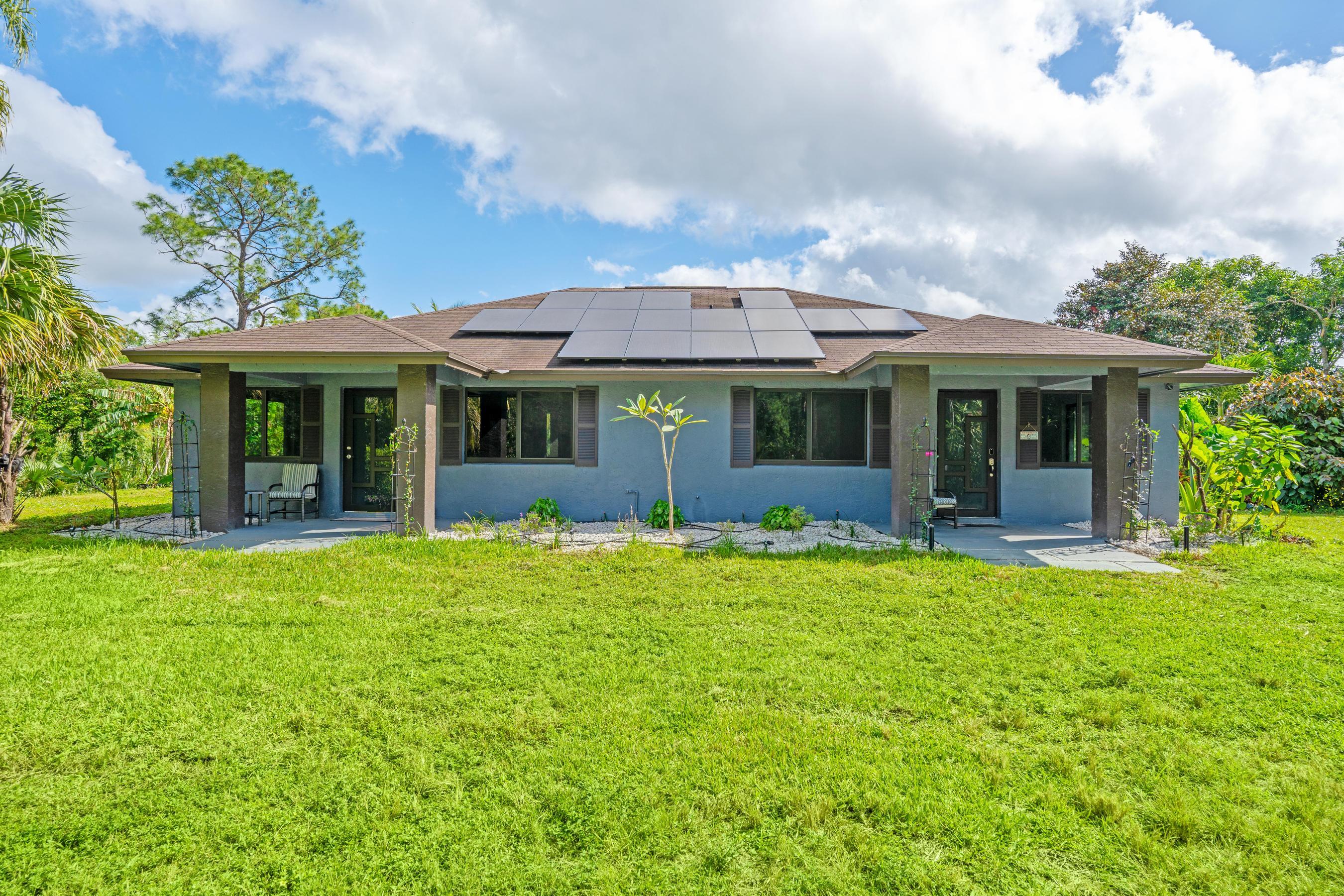 front view of a house with a garden