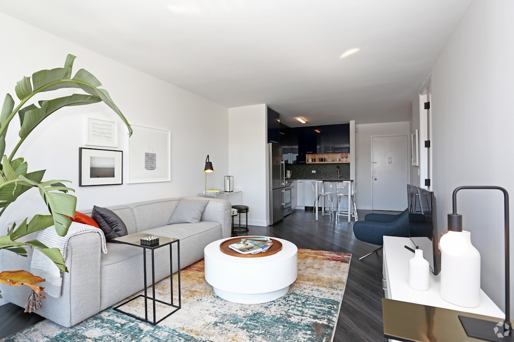 a living room with furniture and a table