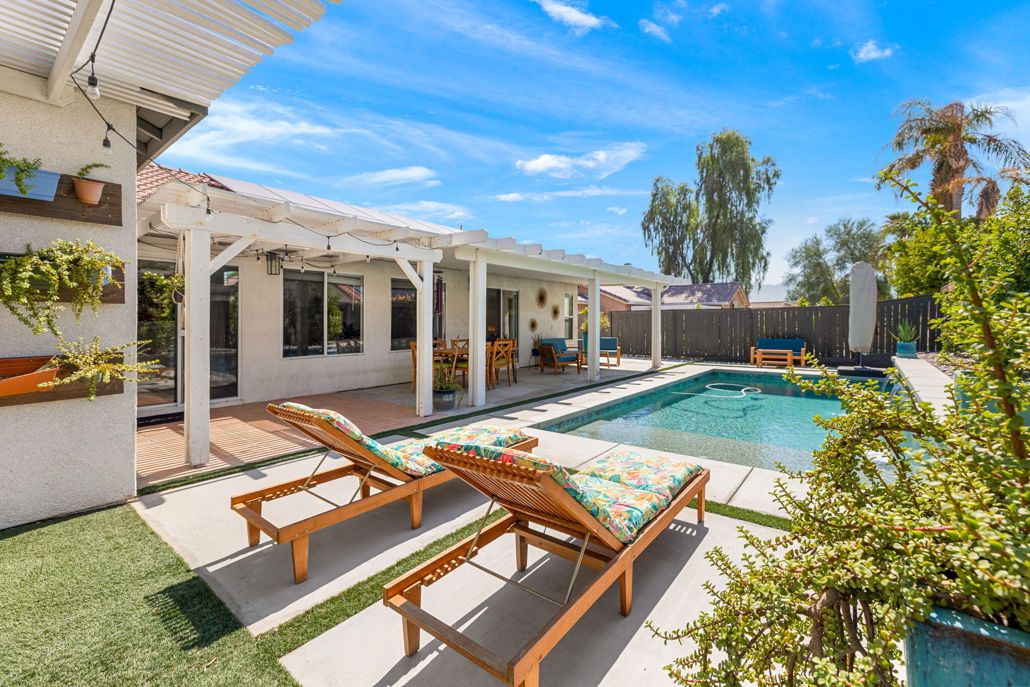 a view of a patio with chairs and tables