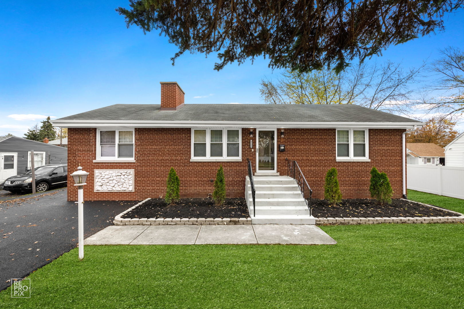 a front view of a house with a yard