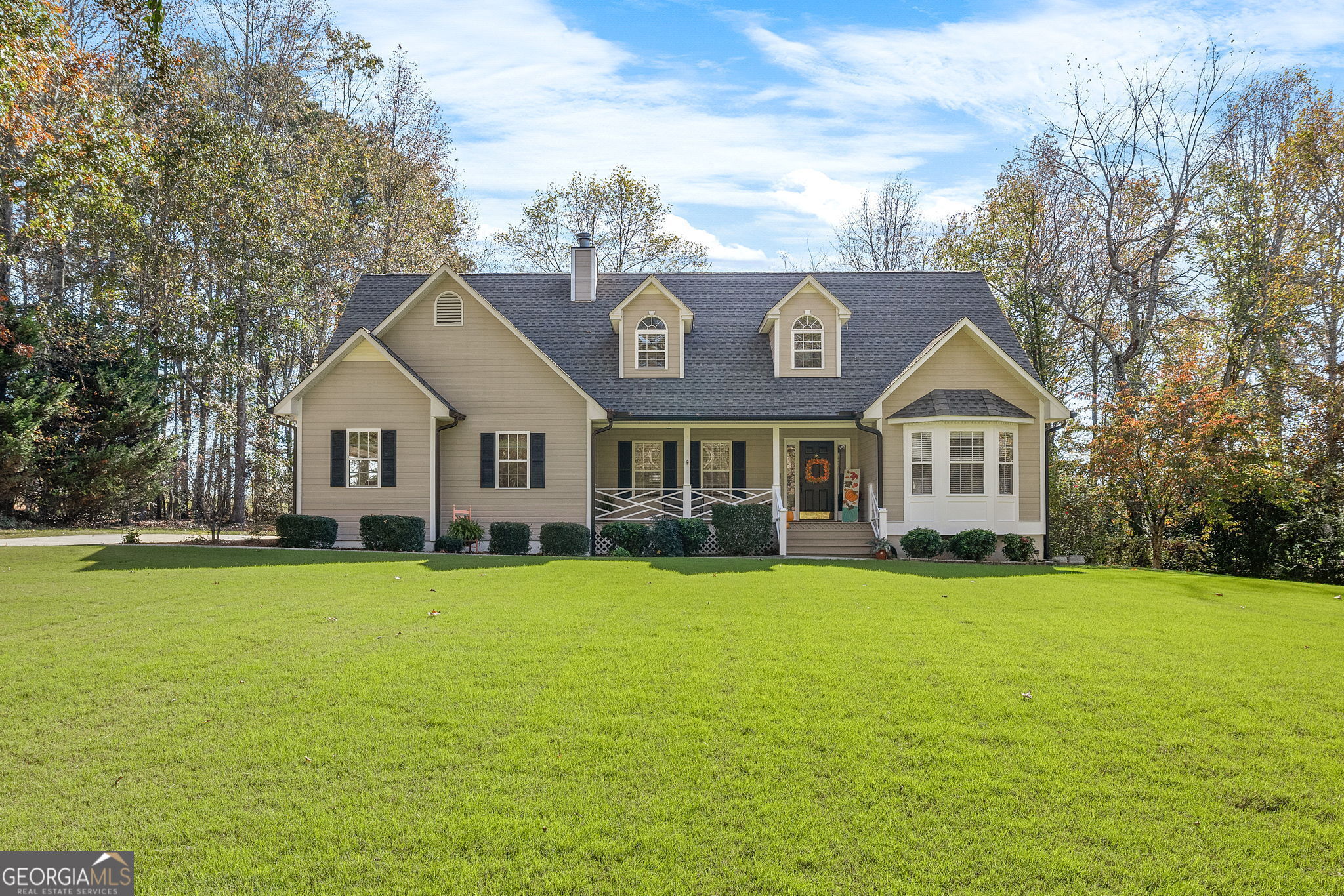 a front view of a house with a yard