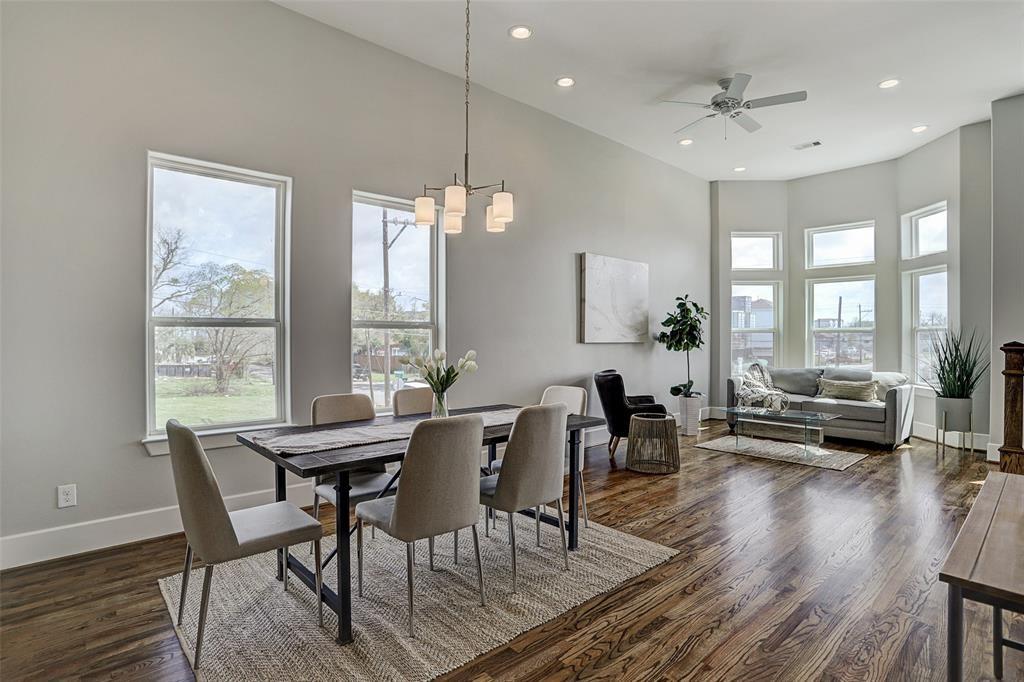 a view of a dining room with furniture window and wooden floor