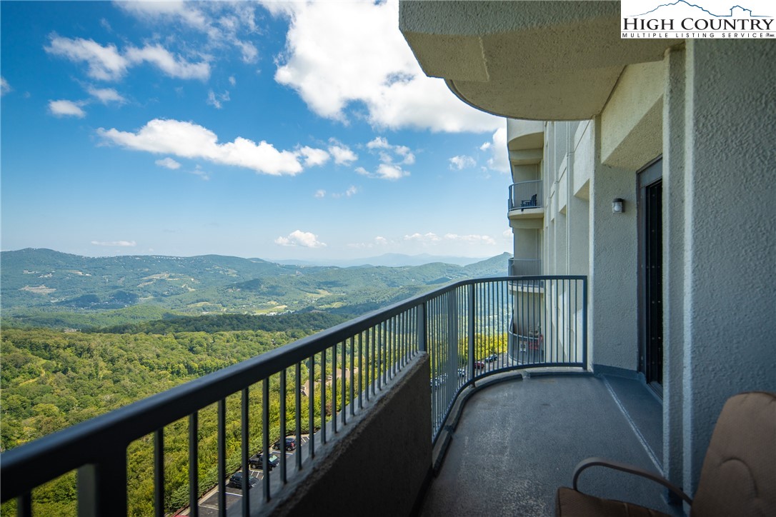 a view of balcony with furniture