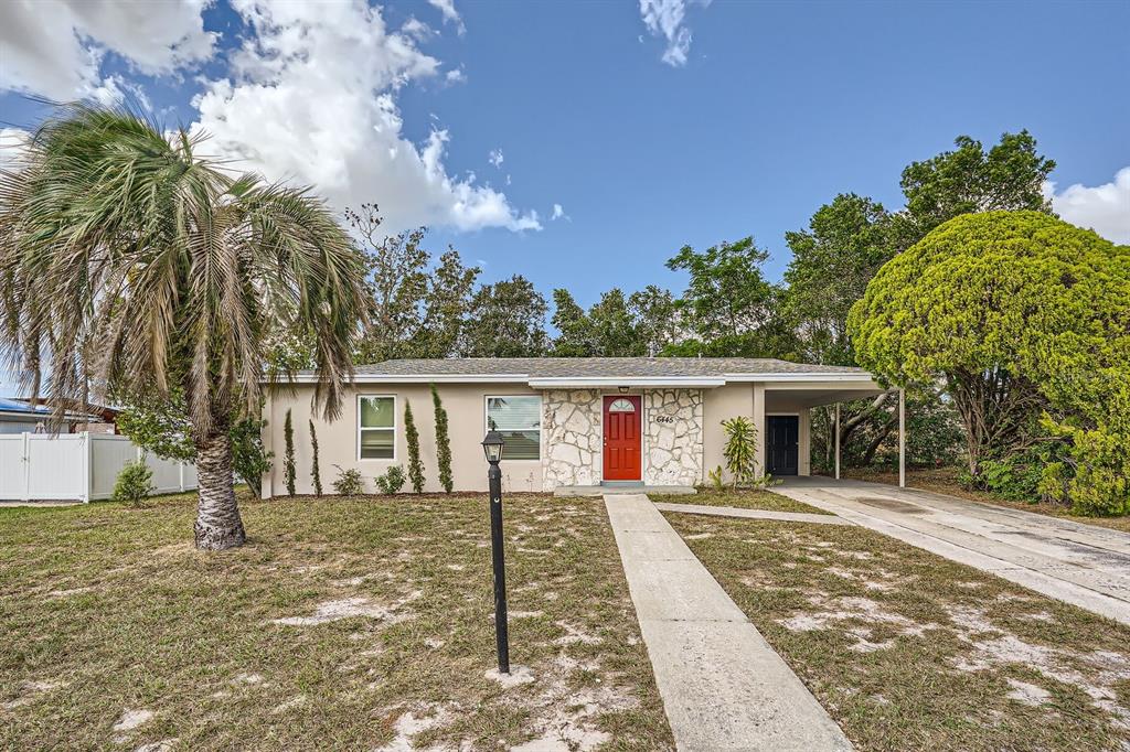 a front view of house with yard outdoor seating and barbeque oven