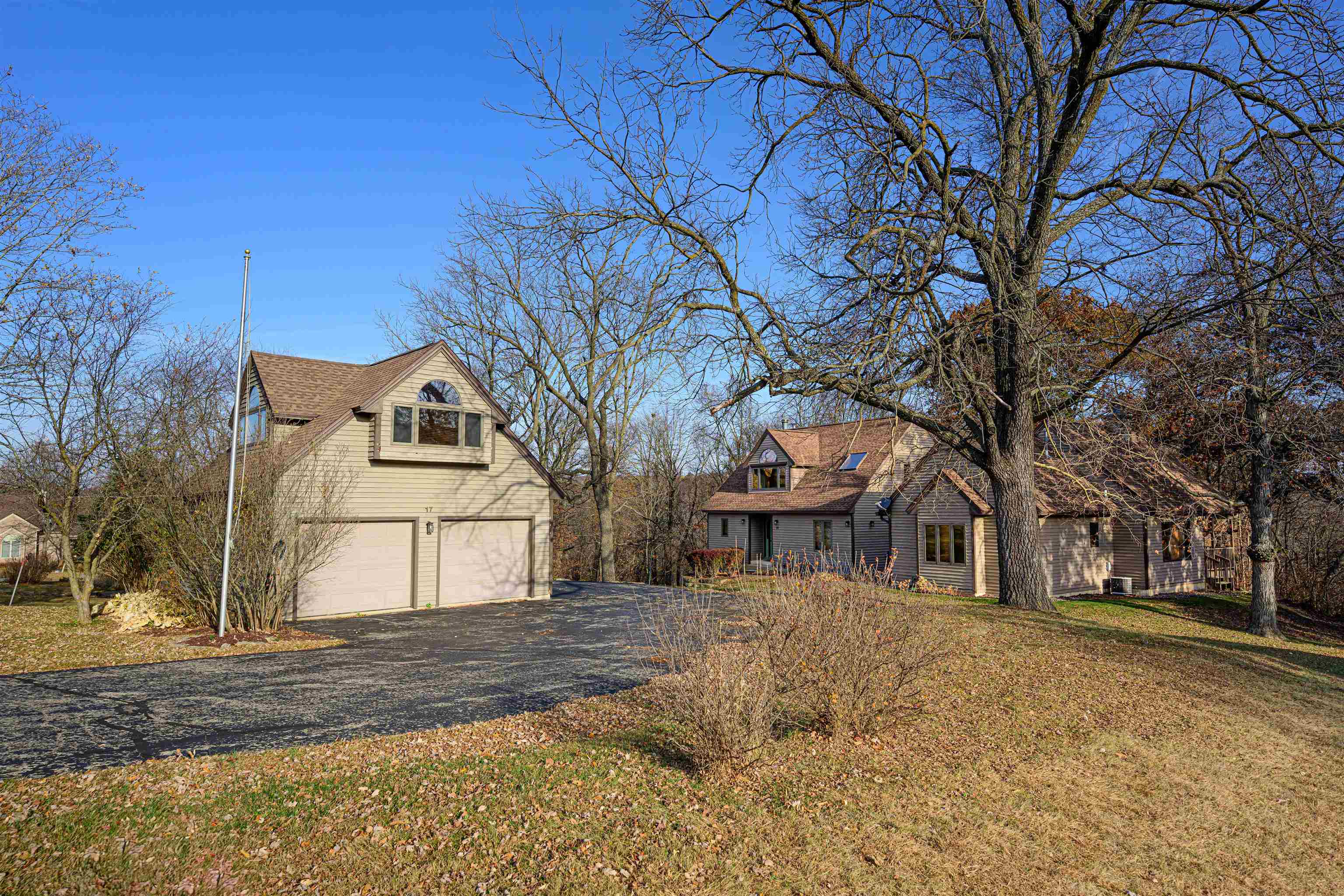 a view of a house with a yard covered in snow