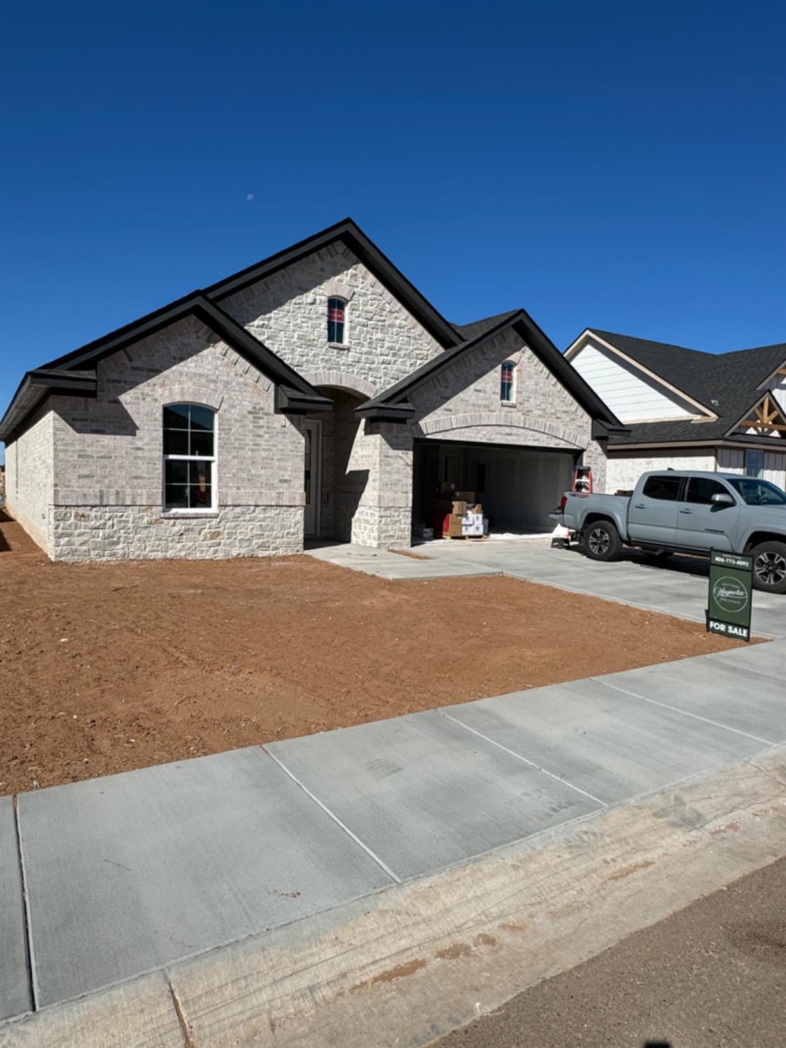 a front view of a house with parking space