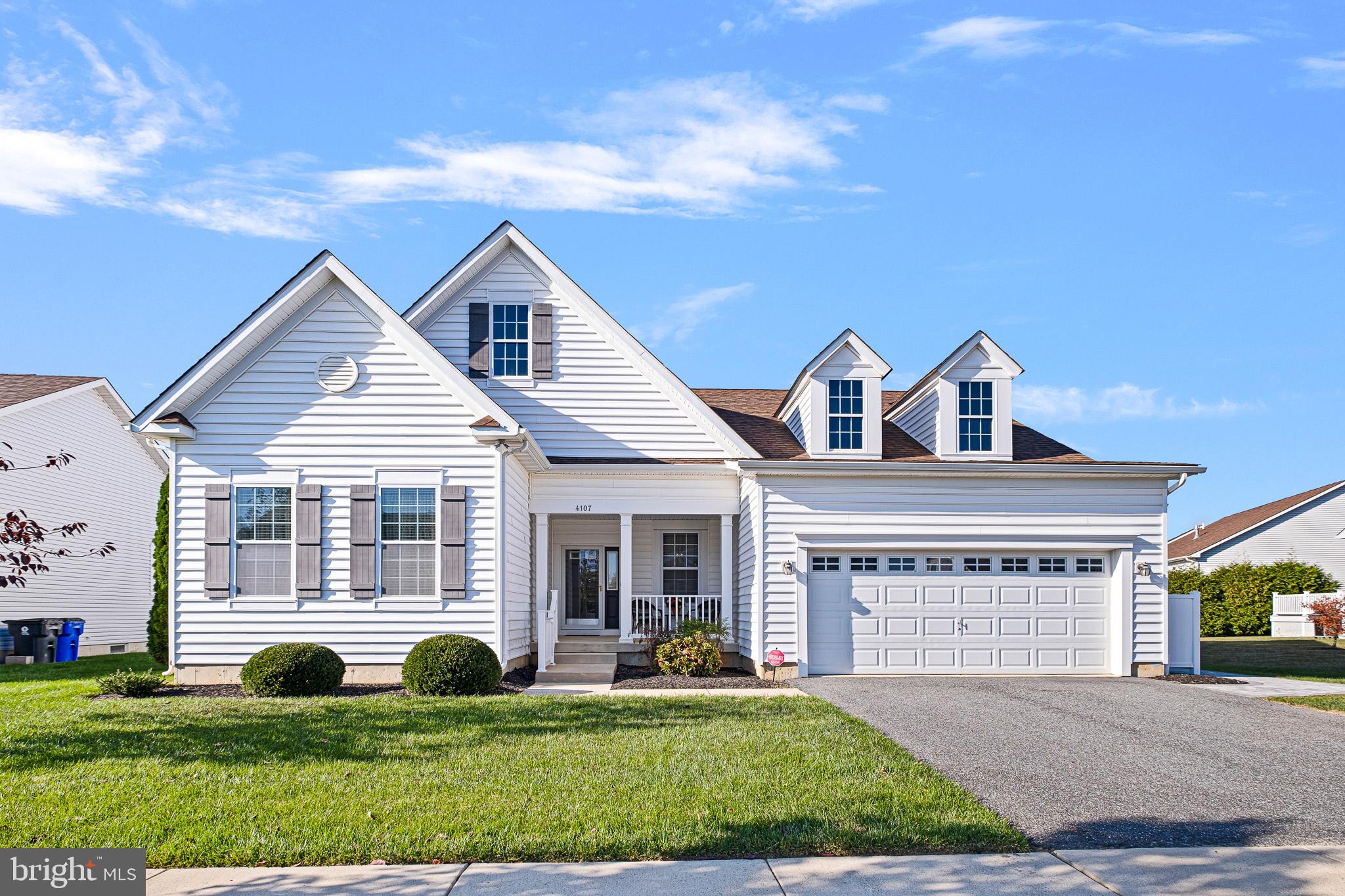 a view of a house with a yard and plants