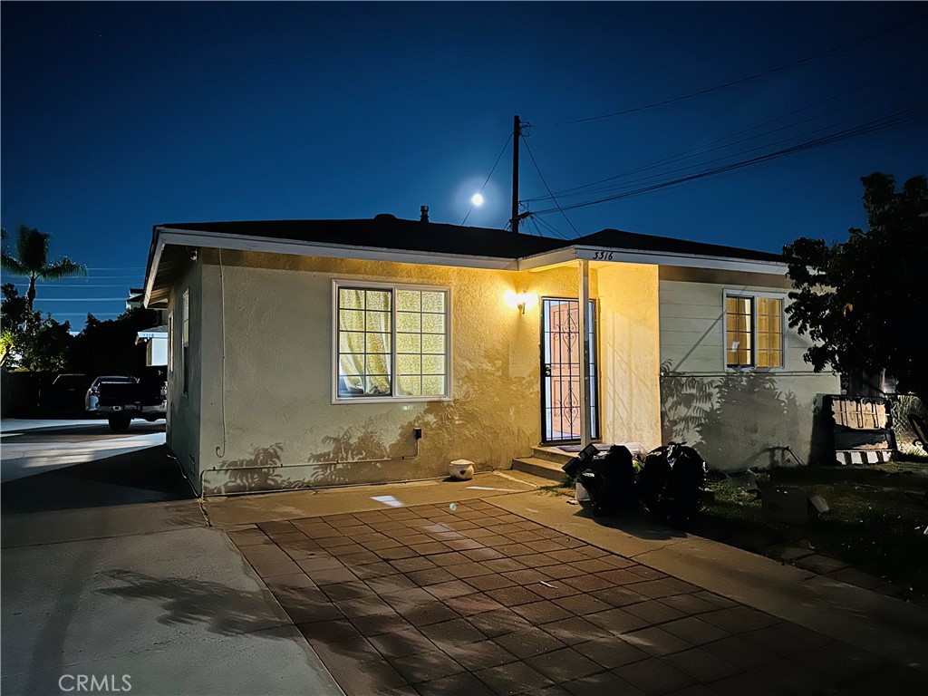 a front view of a house with a patio