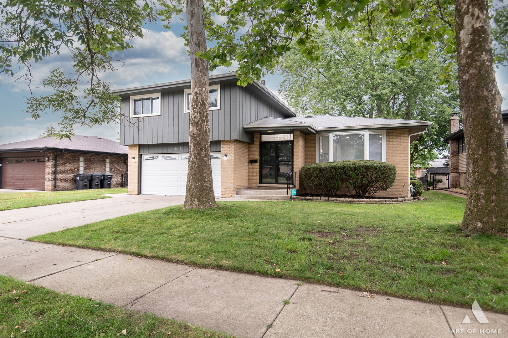 front view of a house that has a yard