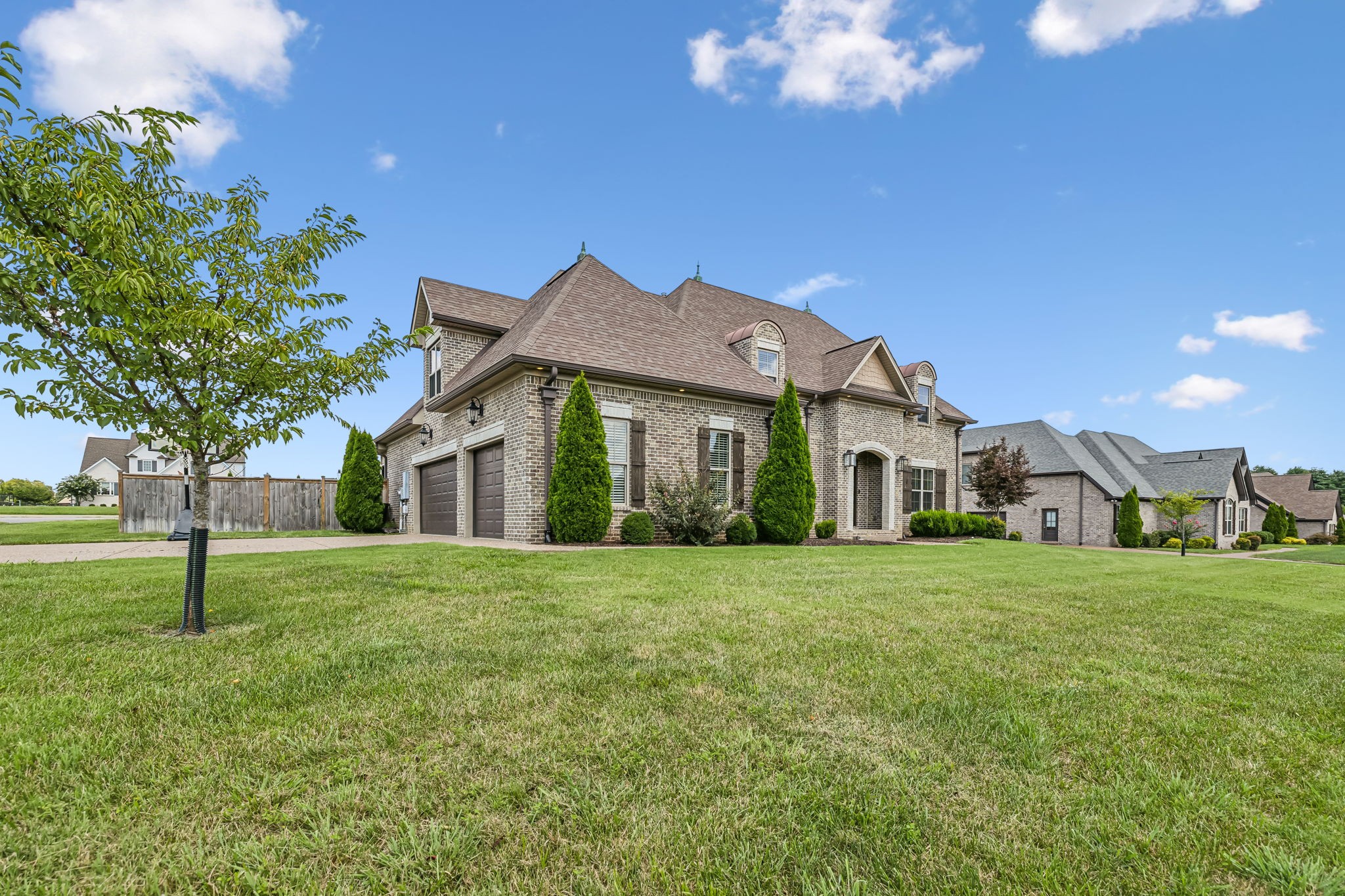 a front view of a house with a yard