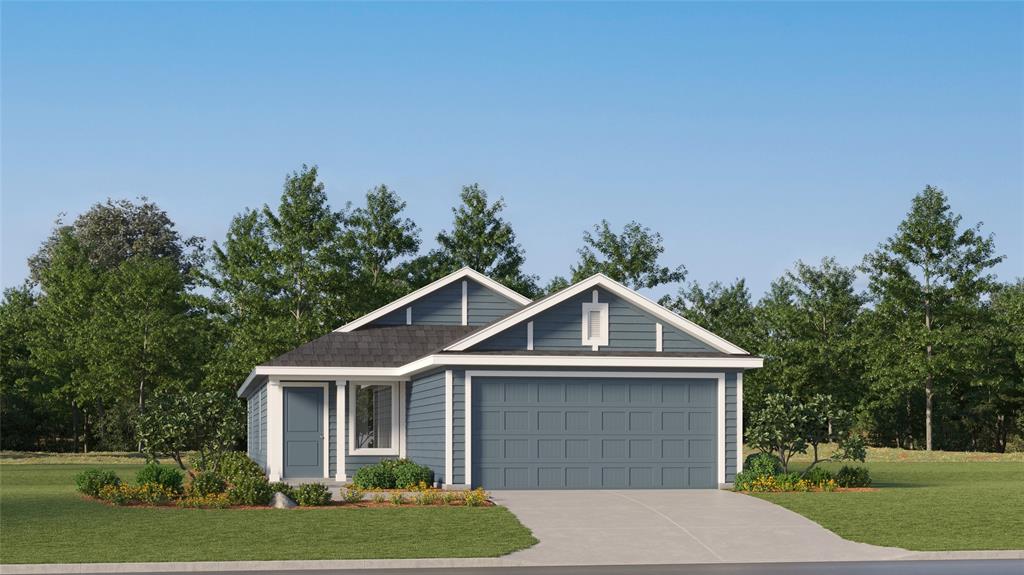 a front view of a house with a yard and trees