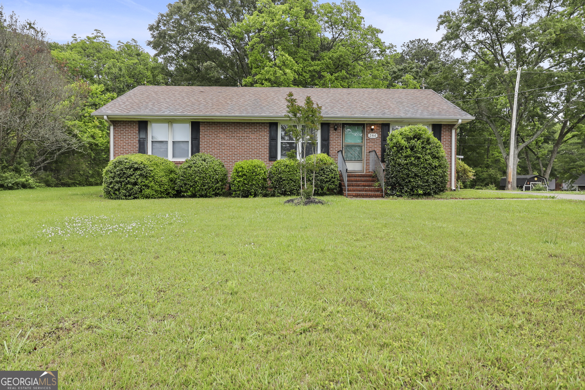 a front view of a house with a yard