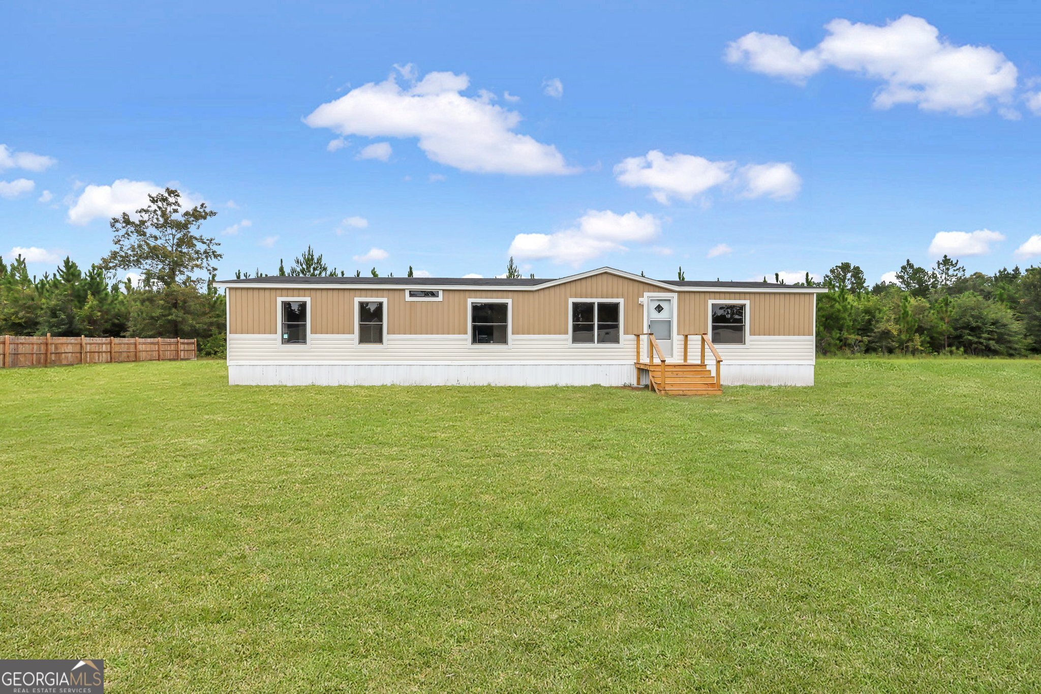 a view of a house with a big yard