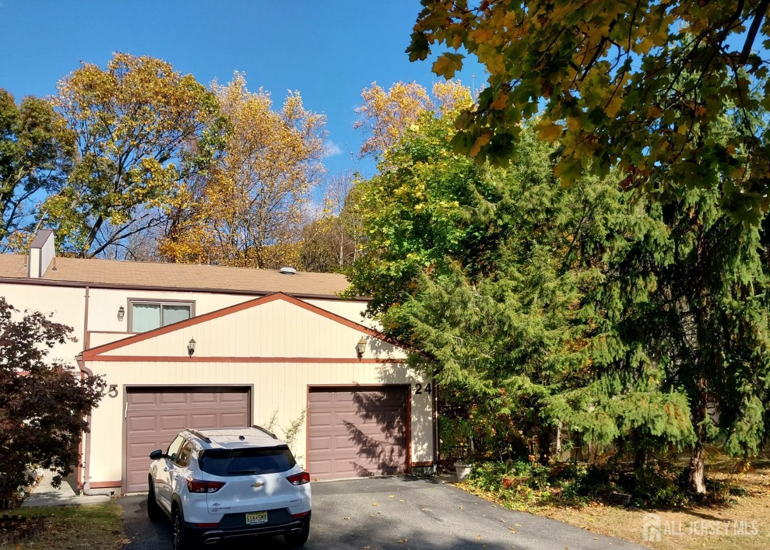 a view of a car park in front of house