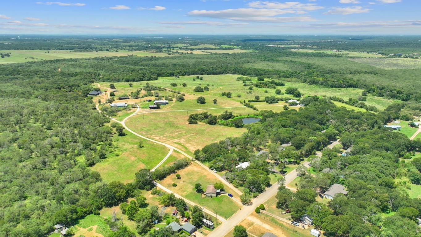 a view of a lake with a yard