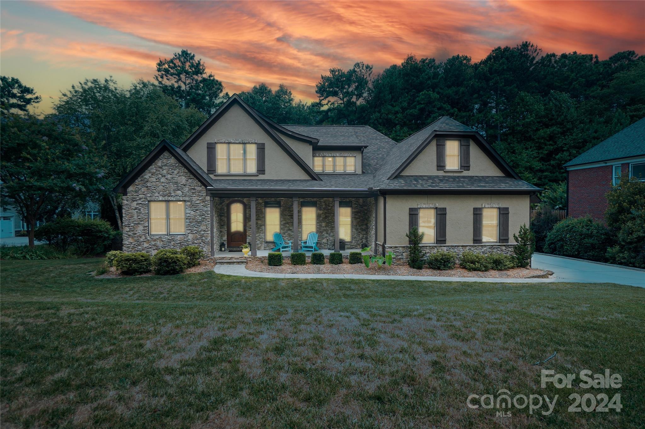 a front view of a house with a yard