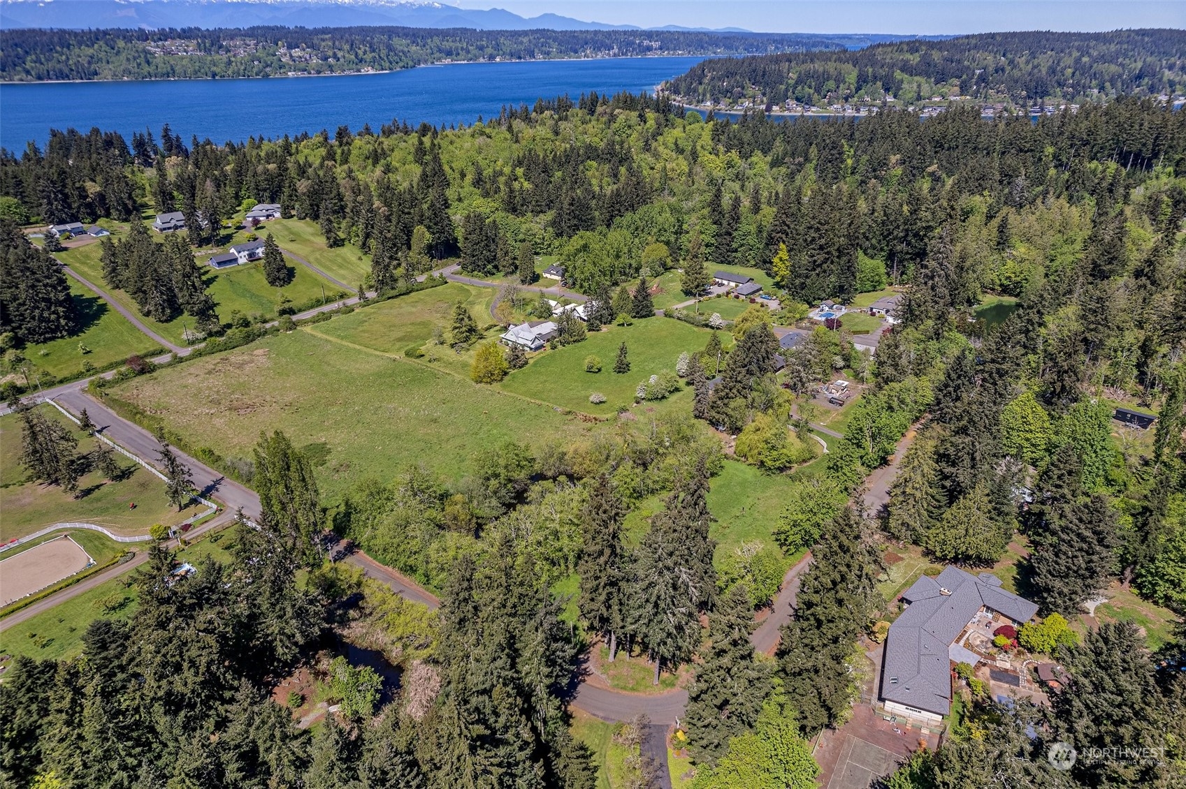 an aerial view of a houses with a yard