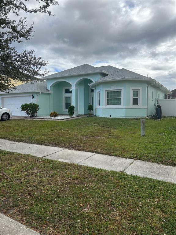 a view of a house with a yard