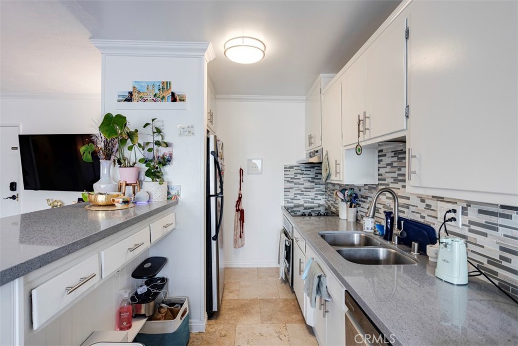 a kitchen with lots of counter top space and wooden floor