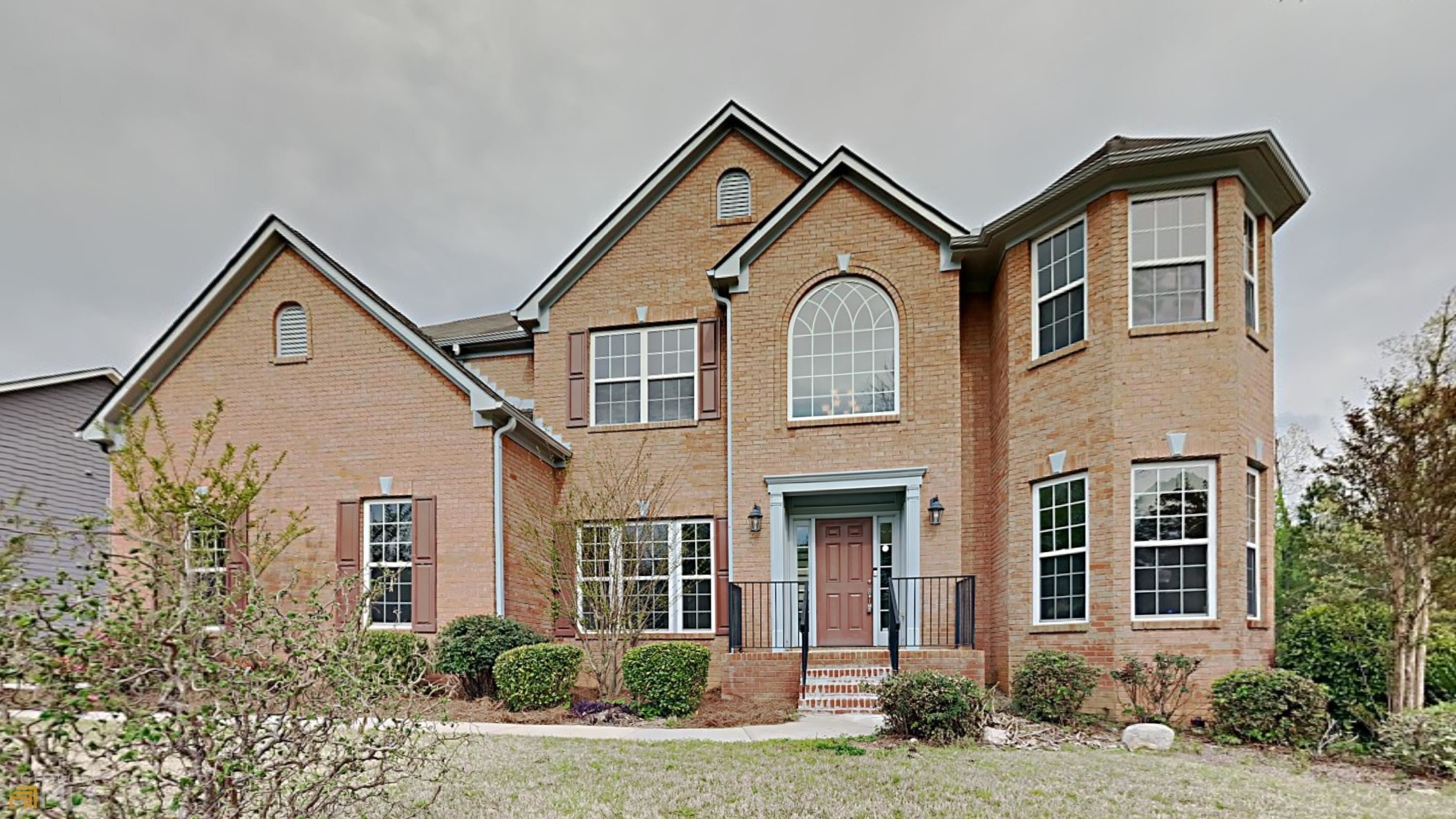 a front view of a house with a yard