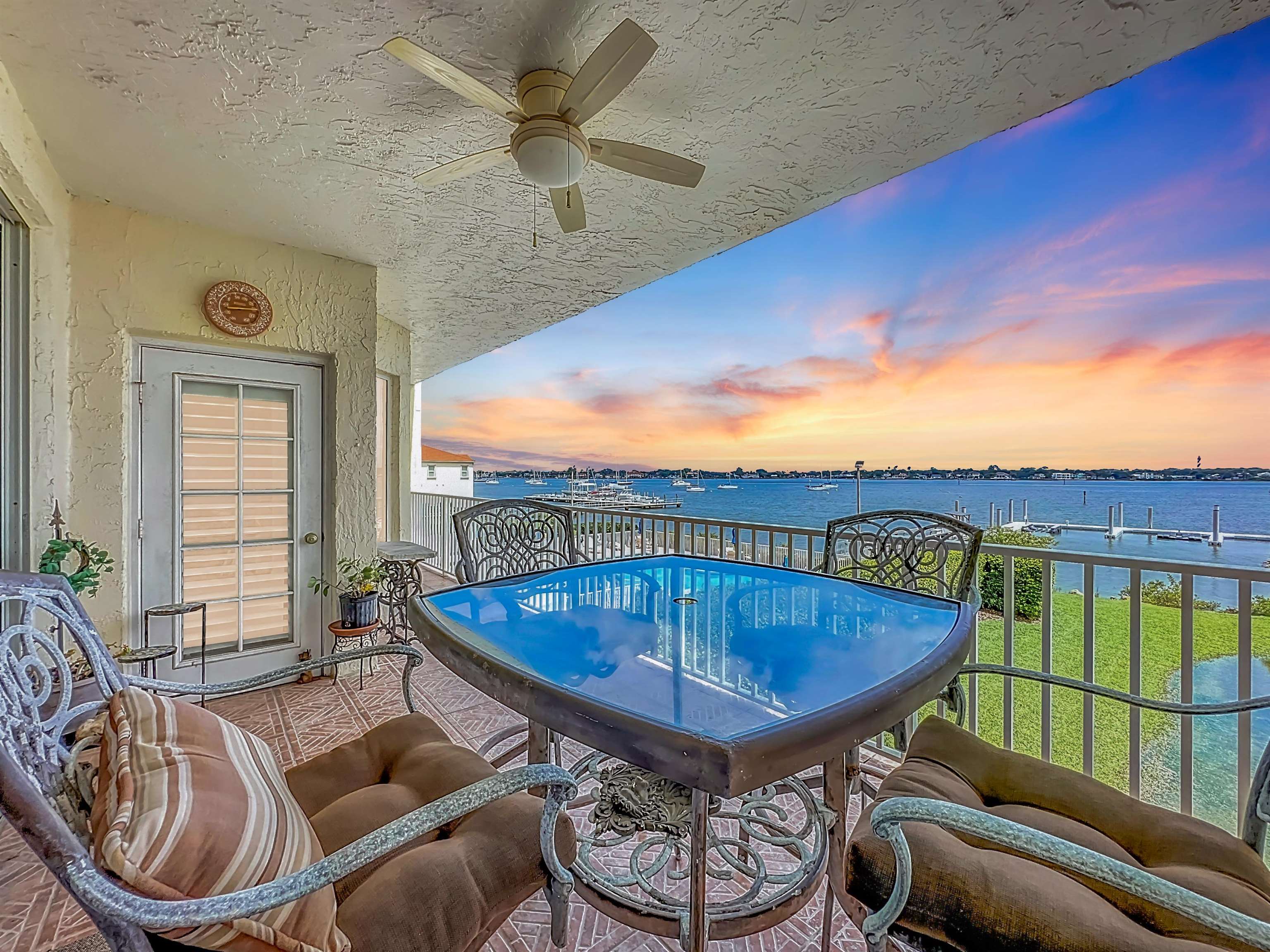 a view of a couches and dinning table in patio