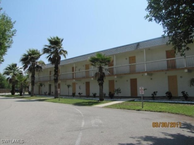 a view of a street with a building in front of it