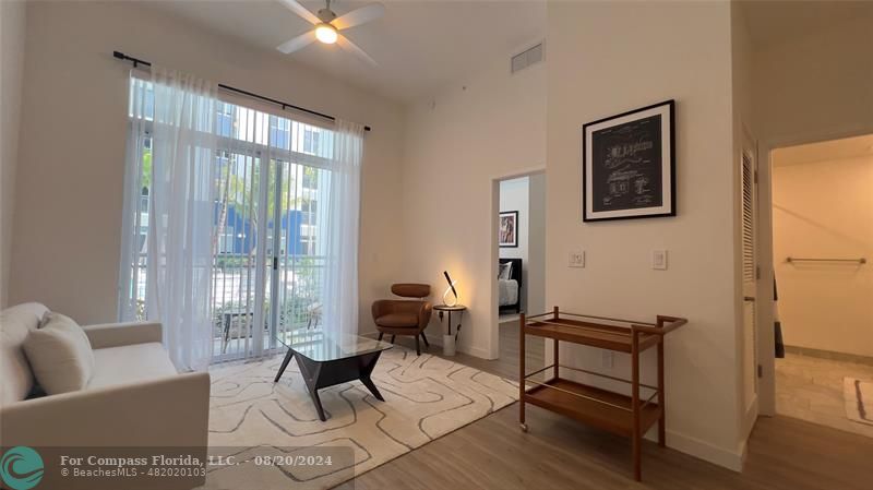 a living room with furniture and a window