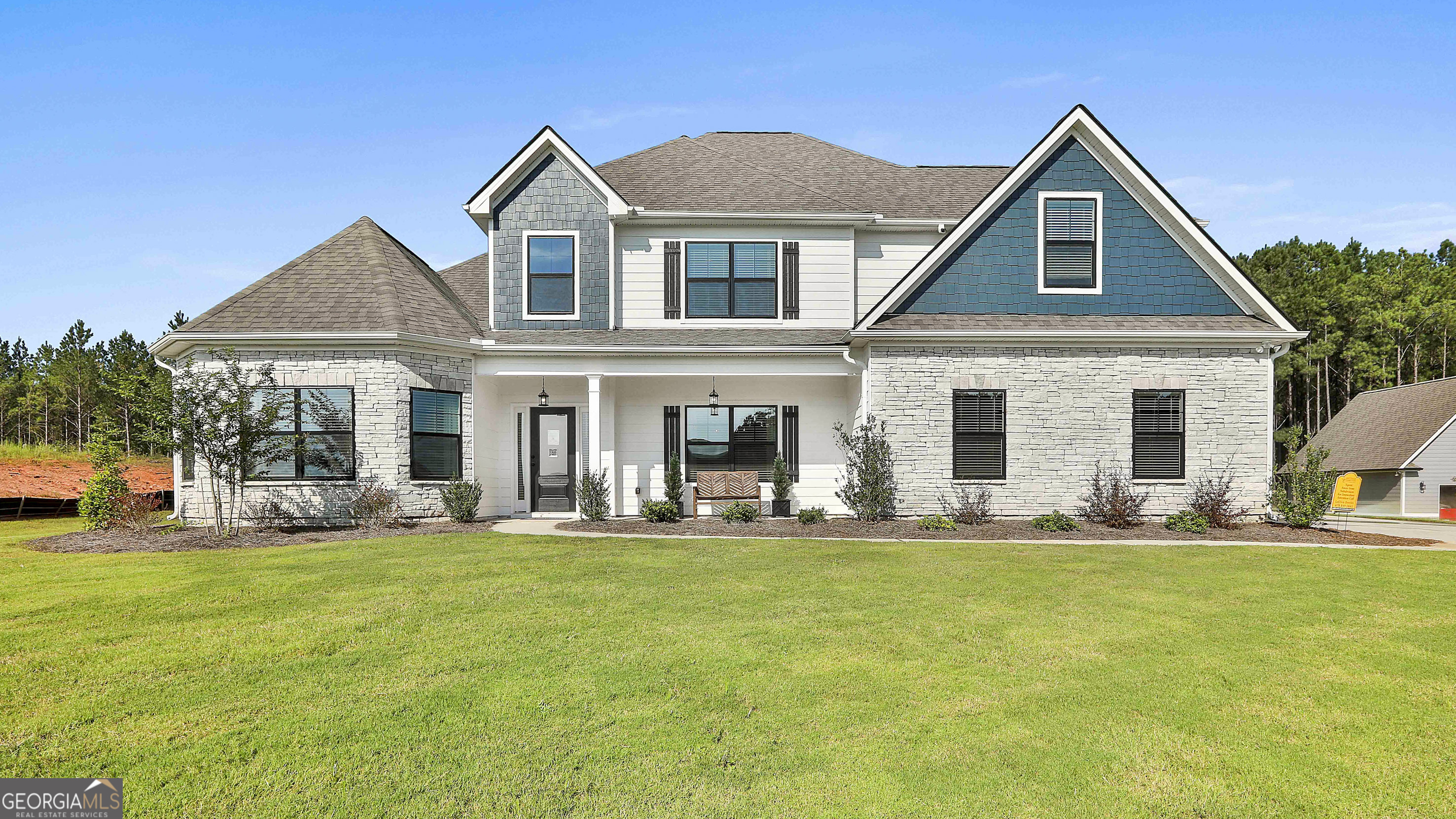 a front view of a house with a yard