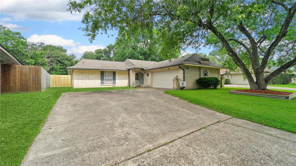 Double Driveway for easy parking and large shade tree !