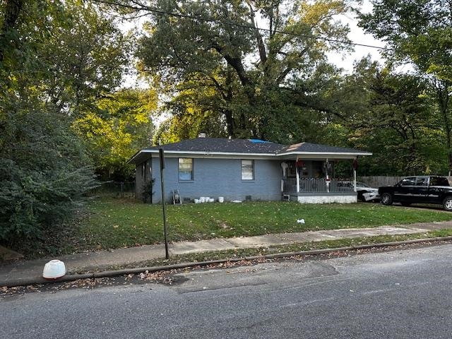 a view of a house that has a backyard