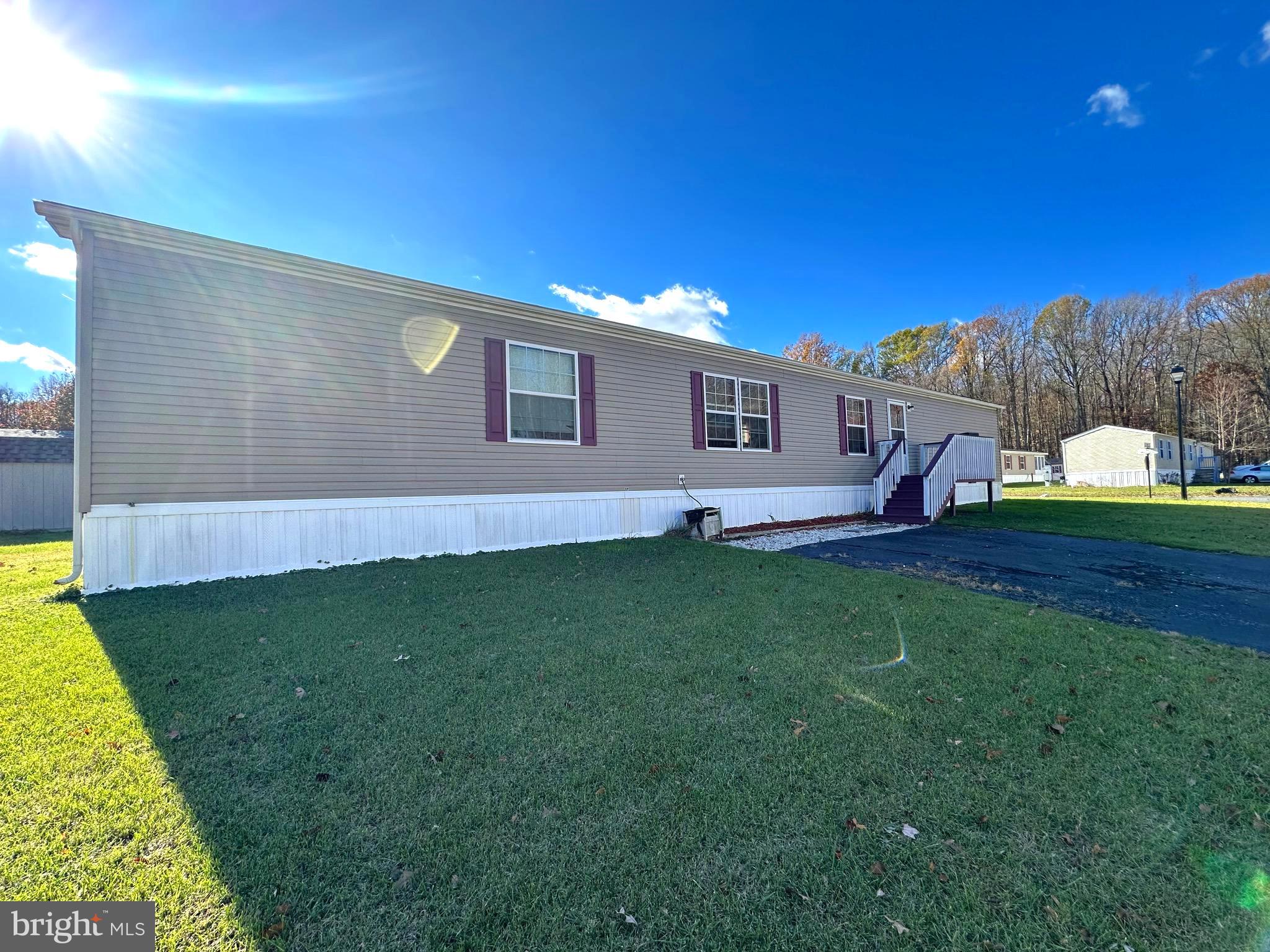 a view of a house with a backyard