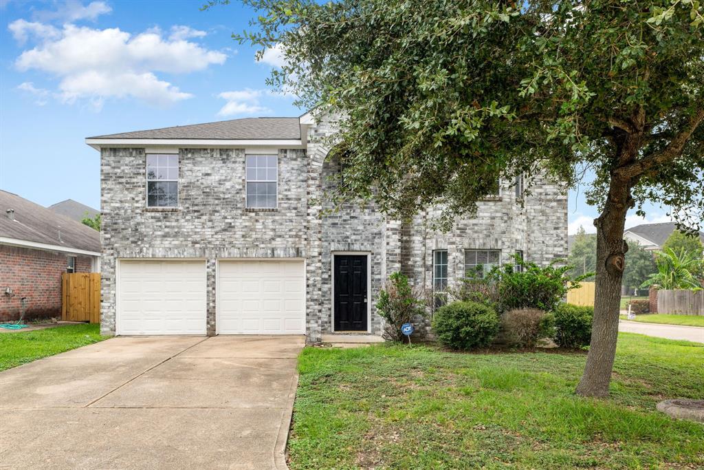 This stunning home has lovely curb appeal, a well-manicured lawn, beautiful landscaping.