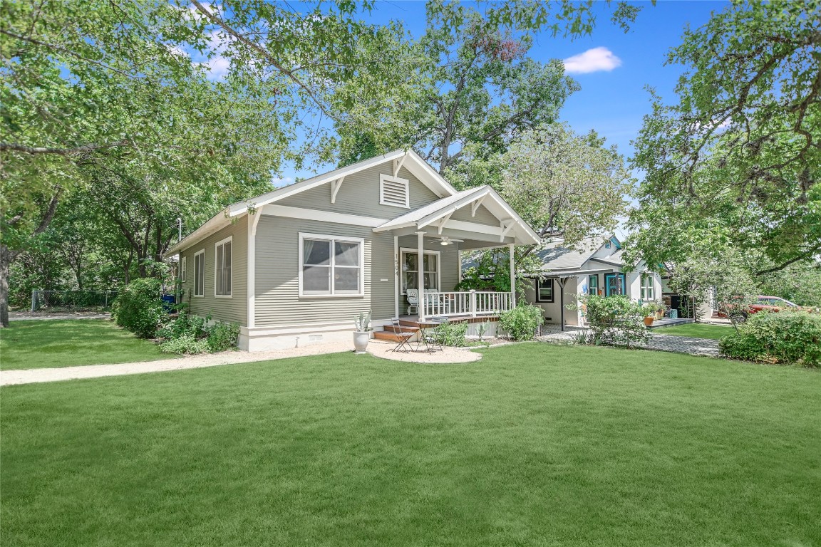 a front view of a house with a yard and porch