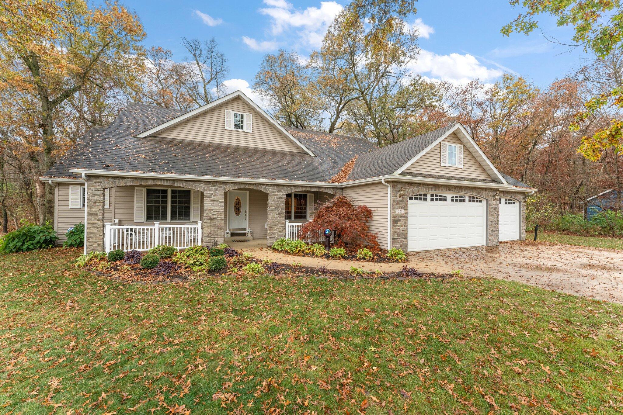 a front view of a house with garden