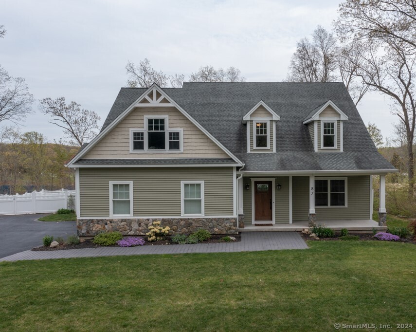 front view of a house with a yard