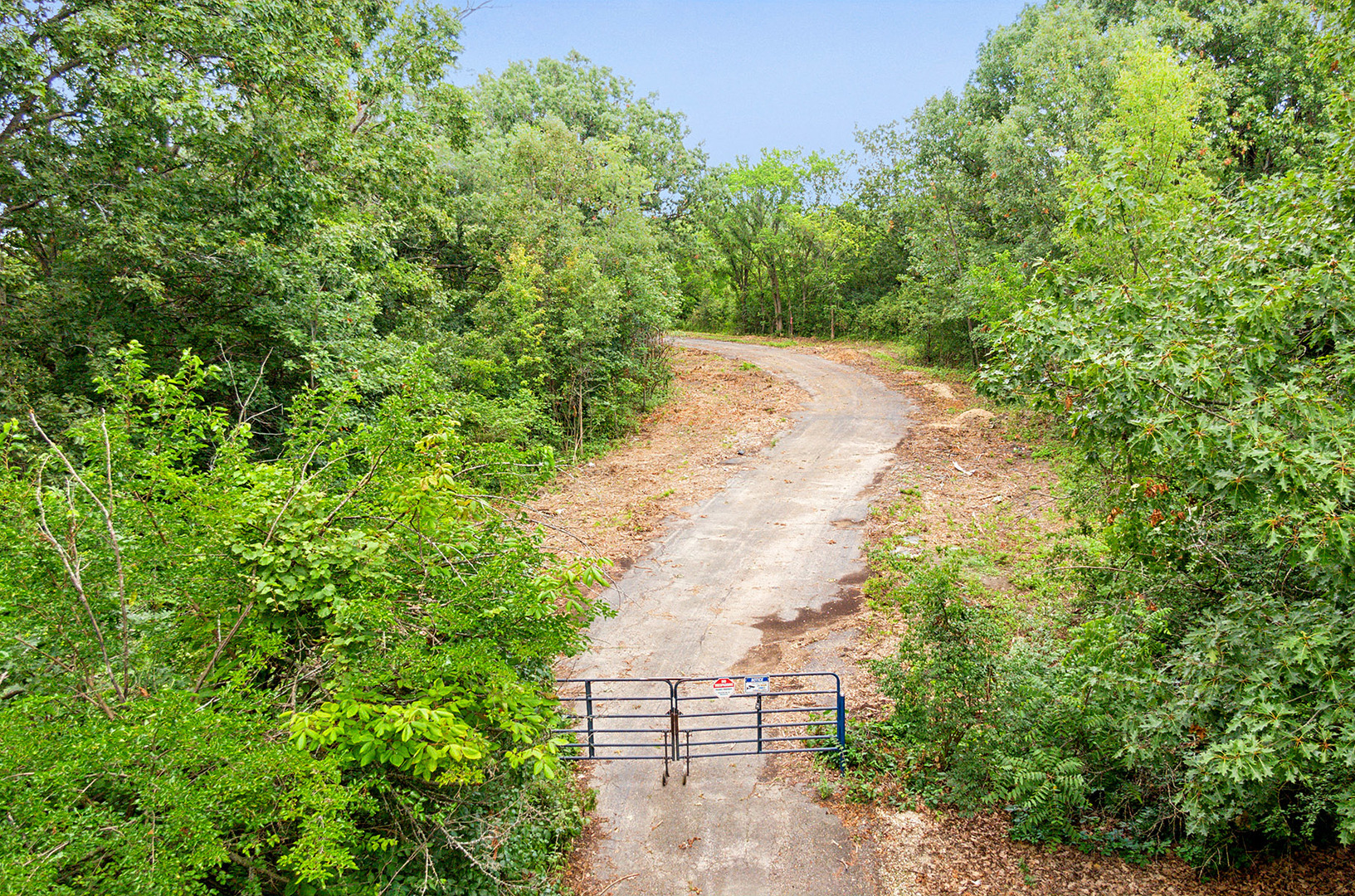 a view of a pathway both side of white house with a yard