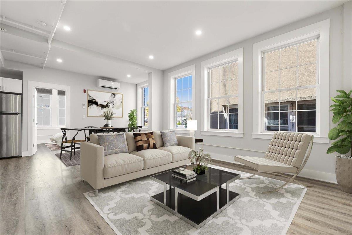 a living room with furniture and a large window