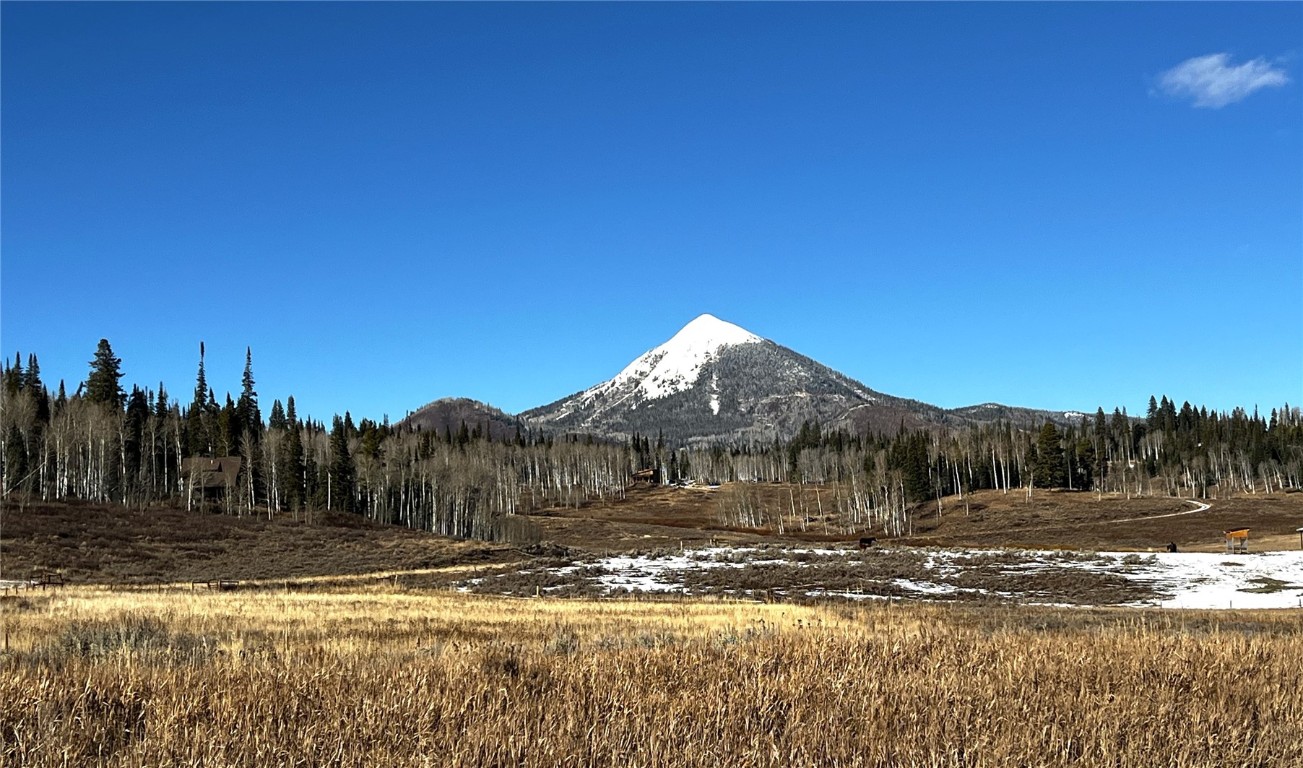 a view of a town with mountains in the background