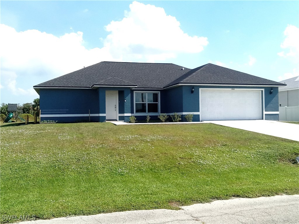 a front view of house with yard