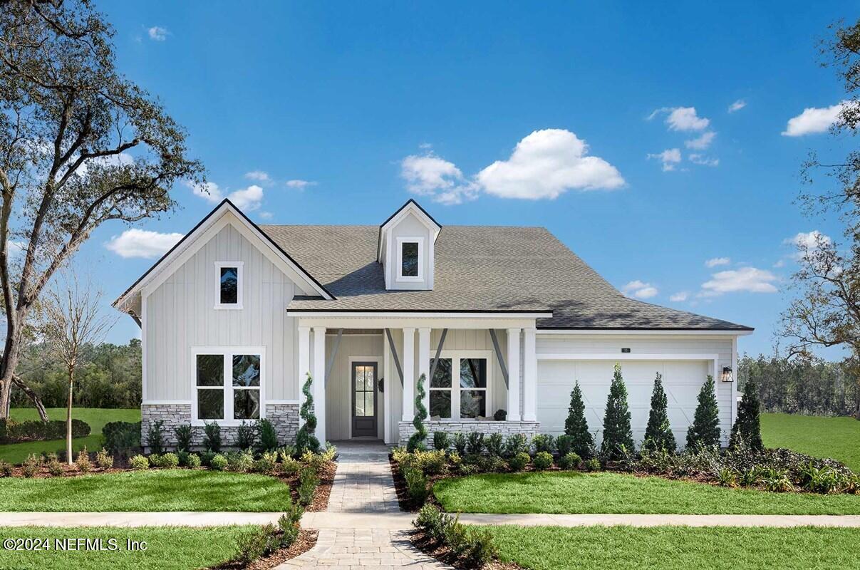 a front view of house with yard and green space