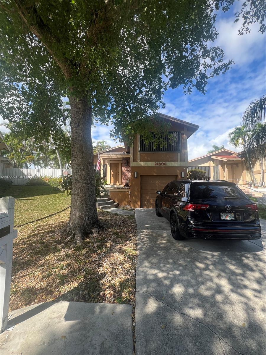 a view of a car in front of a house