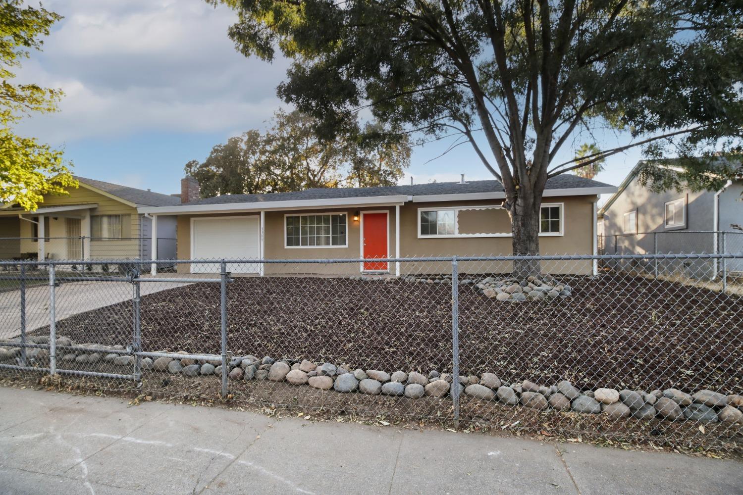 front view of a house with a bench