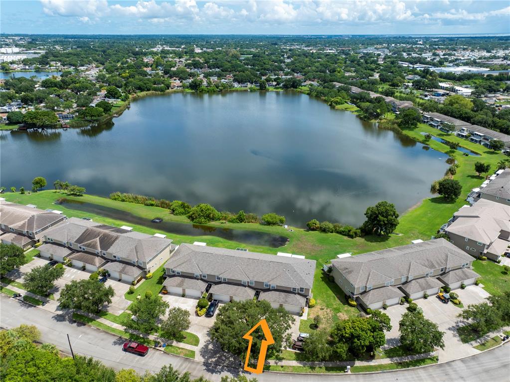 an aerial view of a city with lake view