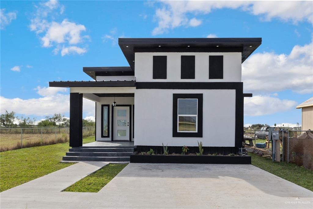 View of front of house with a front lawn