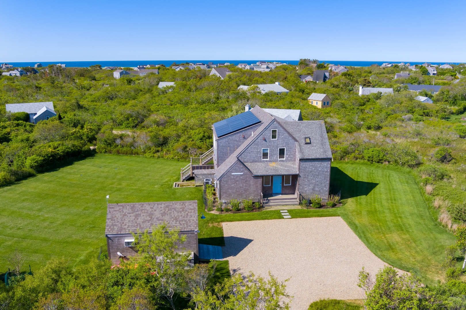 an aerial view of a house with a garden