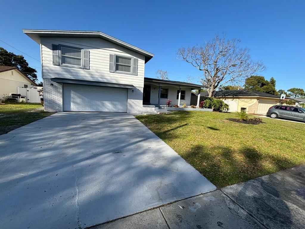 a front view of a house with yard