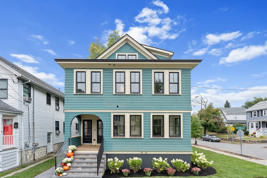 a front view of a house with a yard